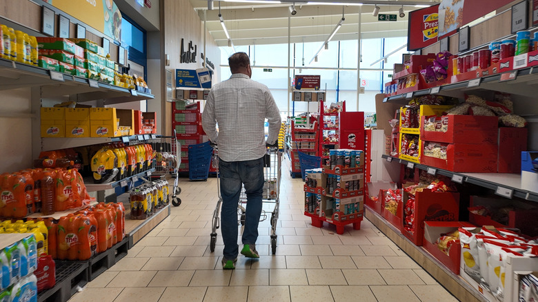 man shopping for snacks