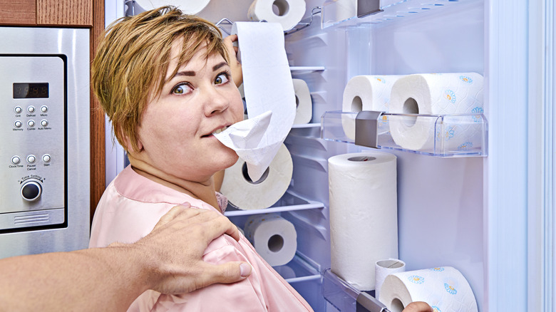 woman eating toilet paper