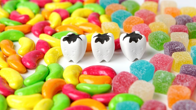 cavity teeth surrounded by candies