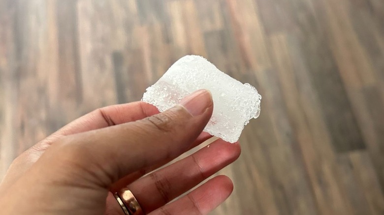 Ice cube in hand