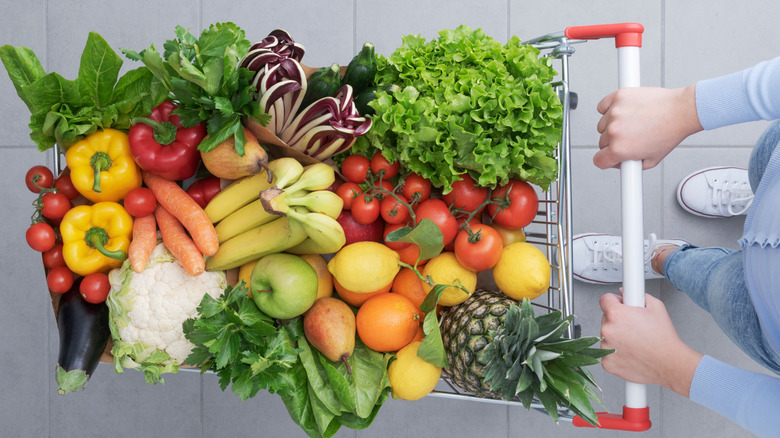 Woman pushing shopping cart