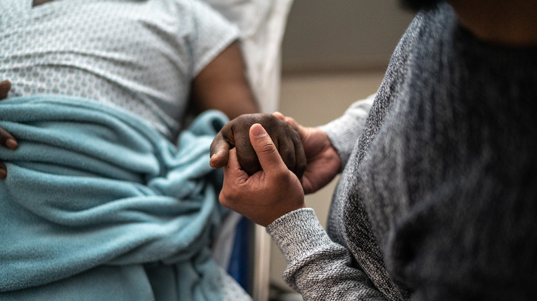 Holding hands in hospital