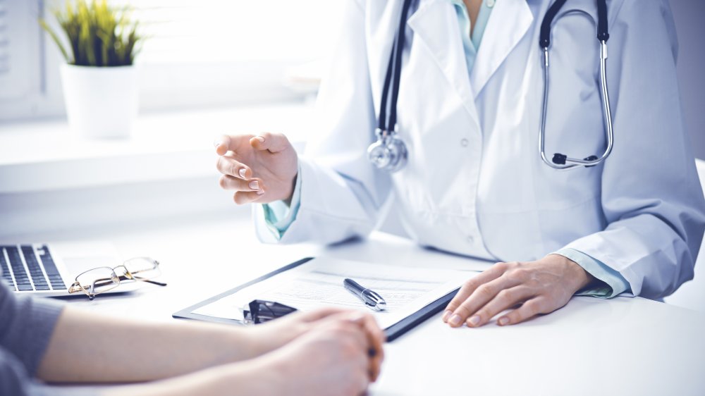 woman talking with doctor