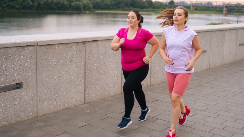 Two women jogging together