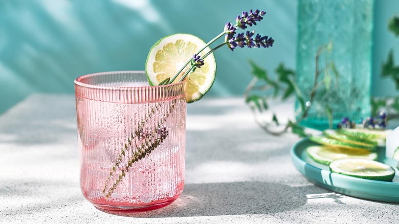 glass of water with lemon and lavender 
