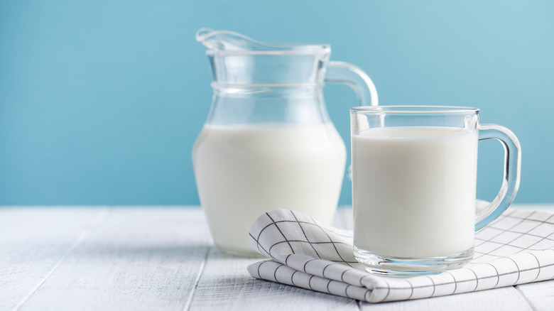 A glass and pitcher of fortified milk 