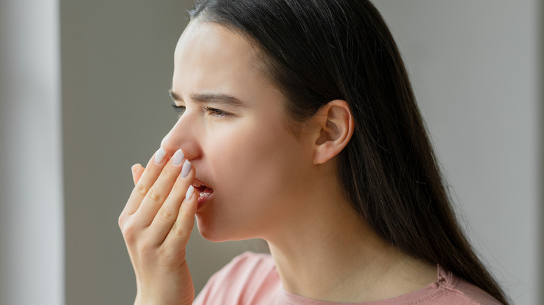 Woman checking her breath