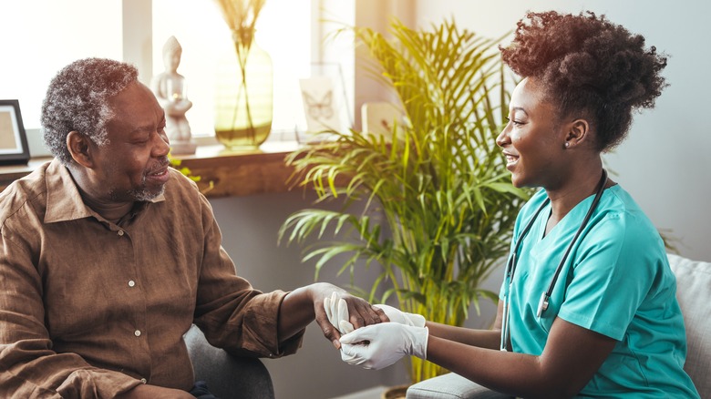 woman and elderly man conversing