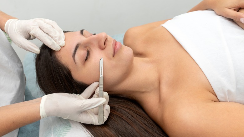 woman receiving dermaplaning procedure