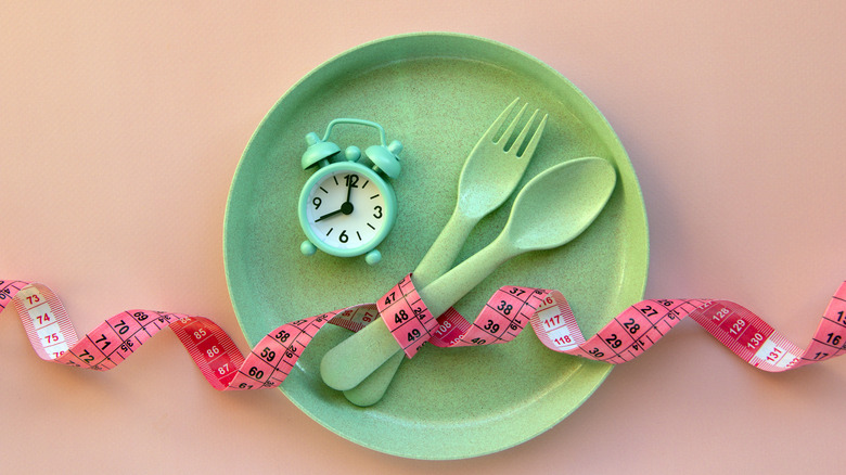 clock sitting on plate