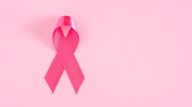 Pink ribbon on a pastel background