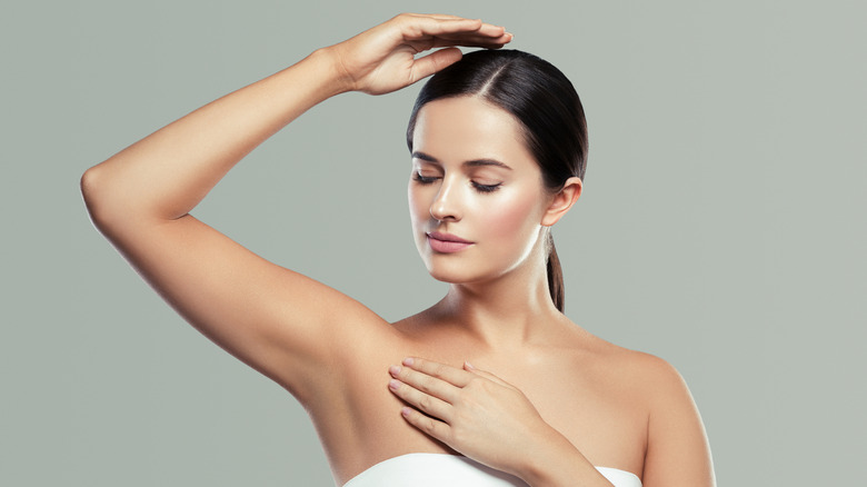 woman looking at armpits