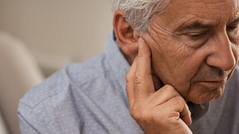 Older man with hearing loss