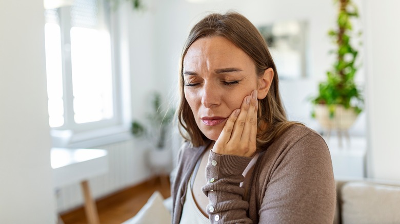 A woman has a toothache