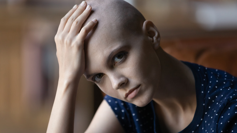 young bald woman after chemotherapy