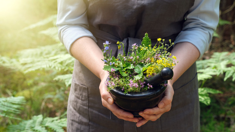 Herbalist with a mortar and pestle