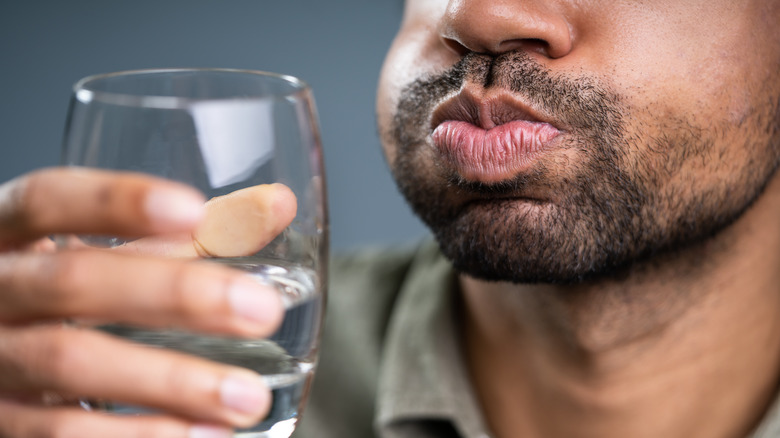 Man gargling water