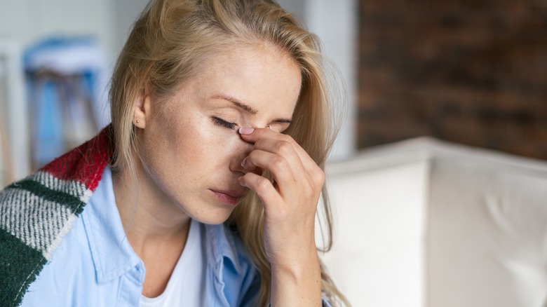 woman suffering from allergy headache