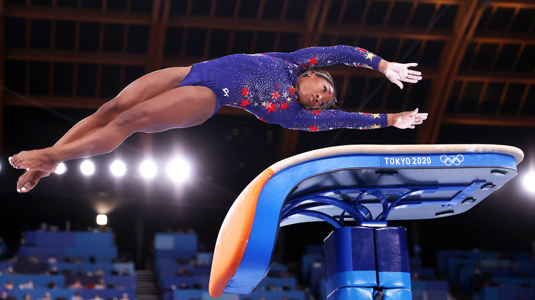 simone biles performing on vault