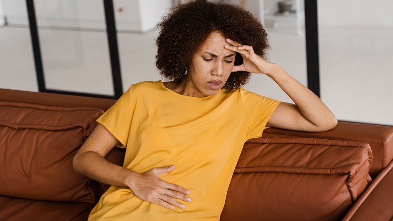 Woman holding her belly