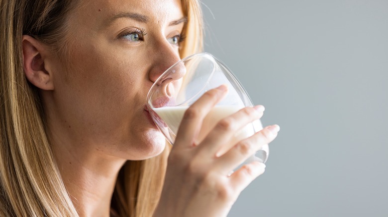 Woman drinking a glass of milk
