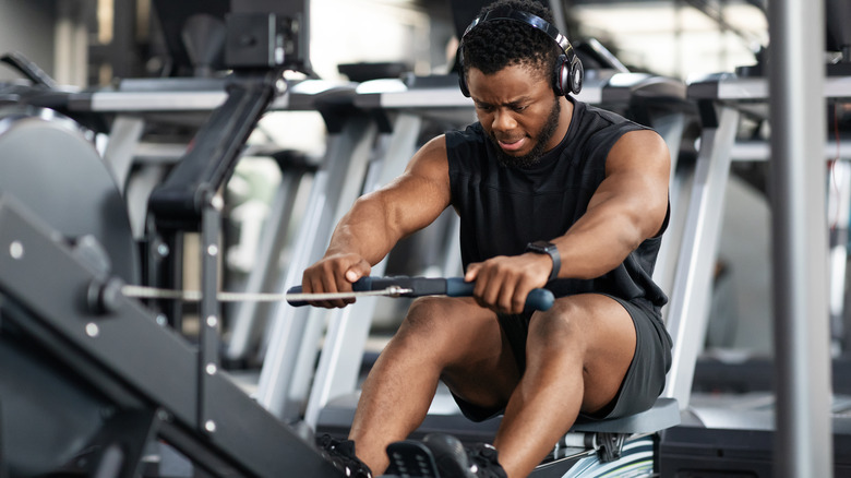 Man using rowing machine