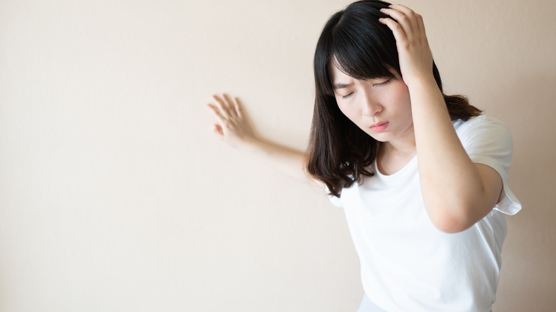 Anemic woman experiencing dizziness