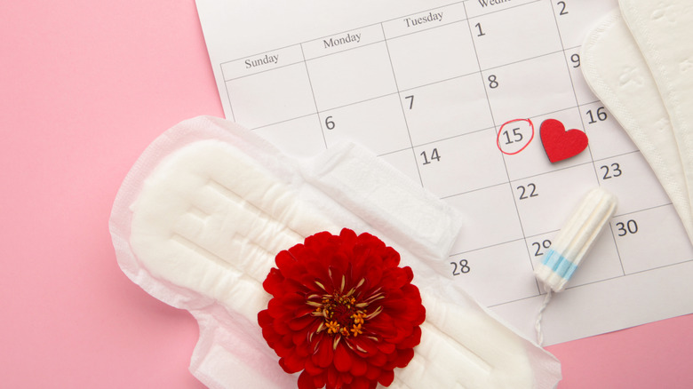 Menstruation calendar with cotton tampons and pads.