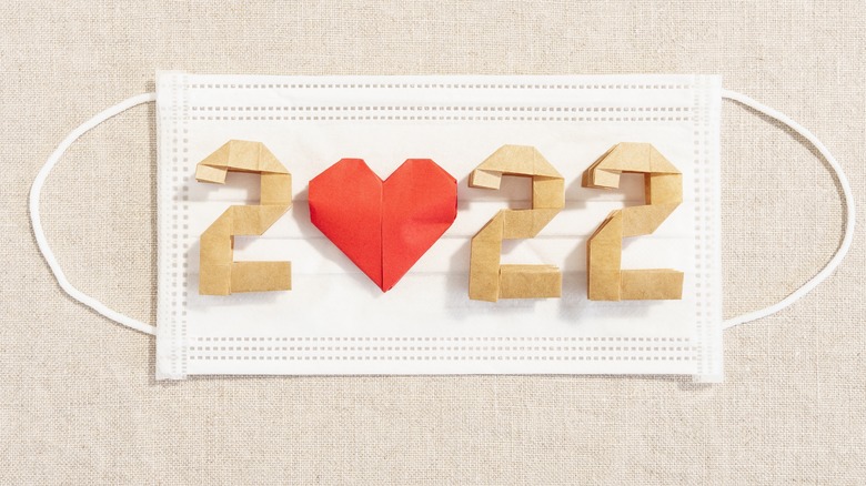 "2022" placed across a surgical face mask with the "0" as a heart