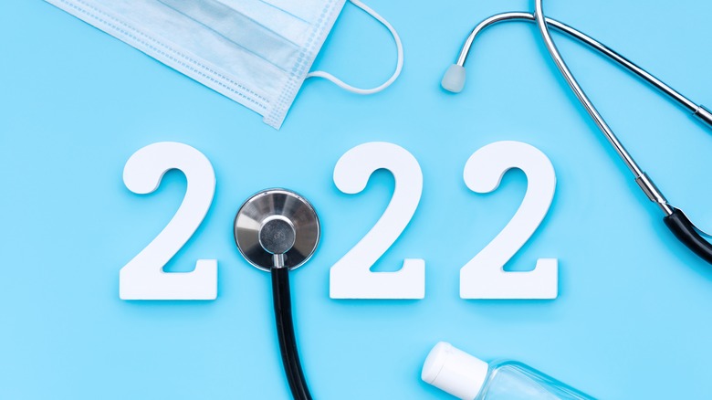 2022 numbers with stethoscope, mask, hand sanitizer