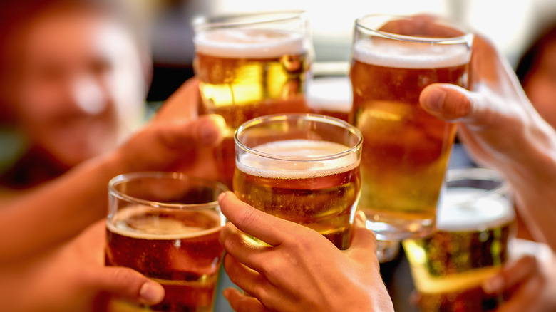 A group of friends are drinking together