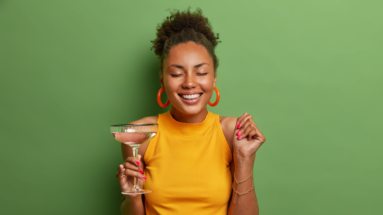 woman with cocktail in hand