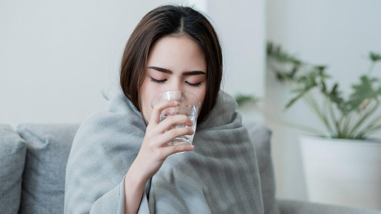 cold woman drinking water