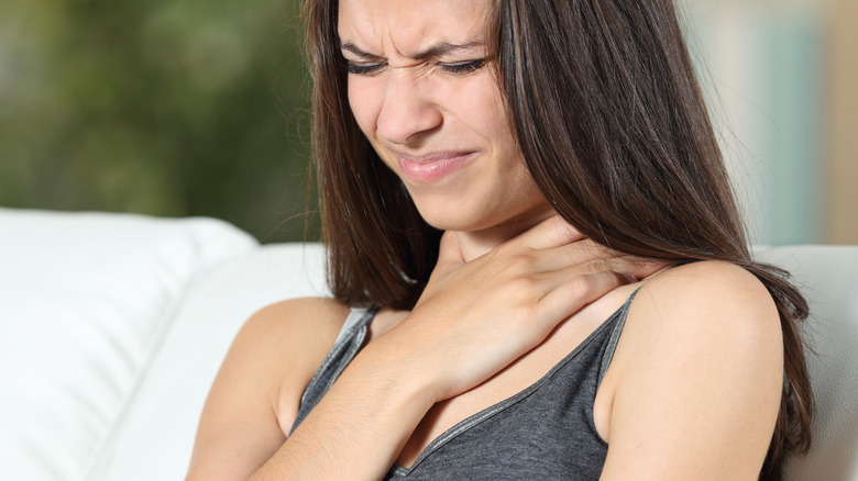 woman in pain after swallowing insect