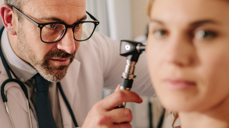 doctor checking ear