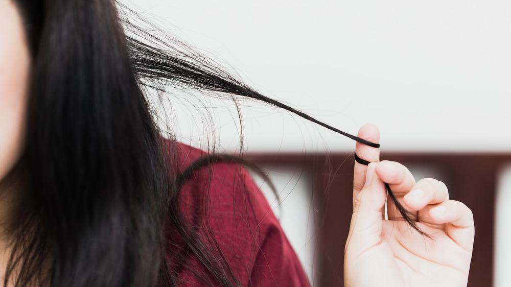 Woman twirling hair with her finger