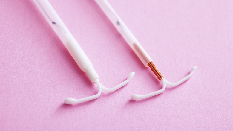 IUDs on pink background