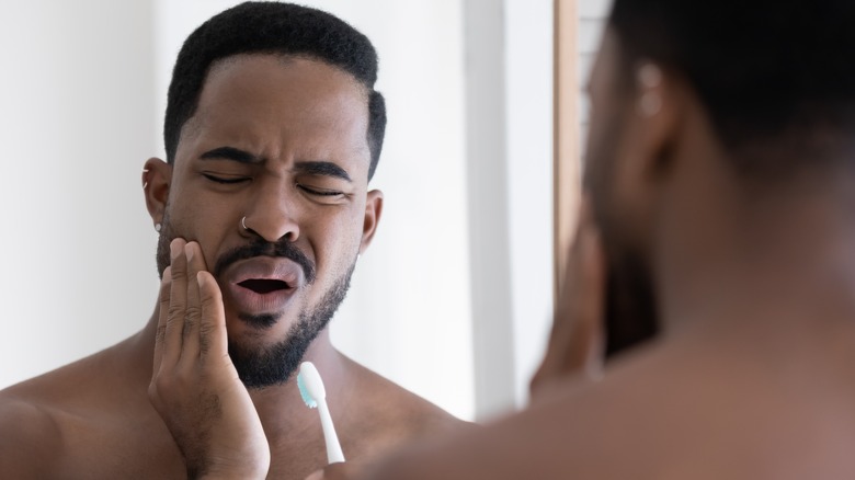 Man with tooth sensitivity