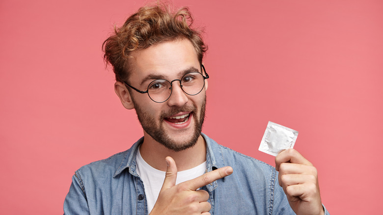 man holding condom