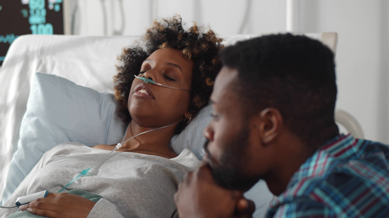 Sleeping woman using breathing ventilator