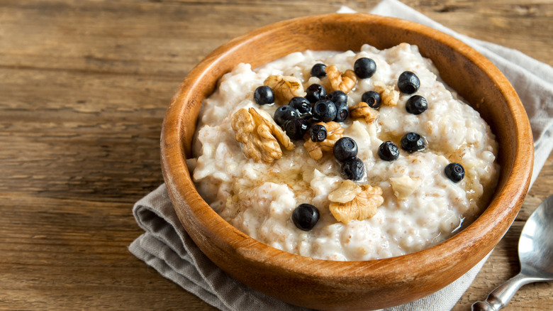 bowl of oatmeal with blueberries and walnuts