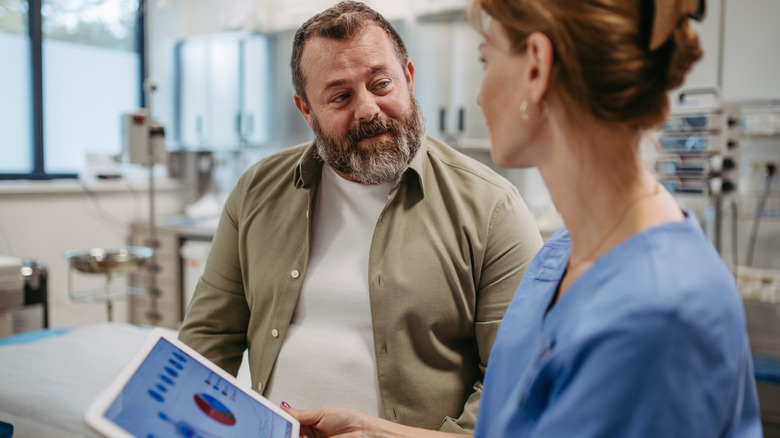 female doctor and male patient discussing test results