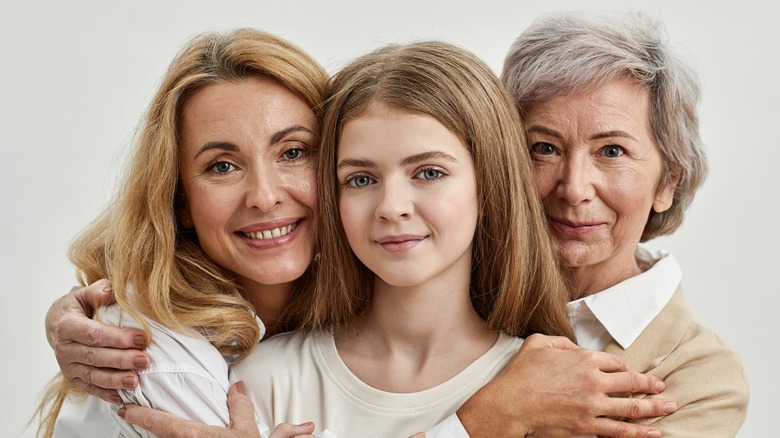 Daughter, mom, and grandmother smiling