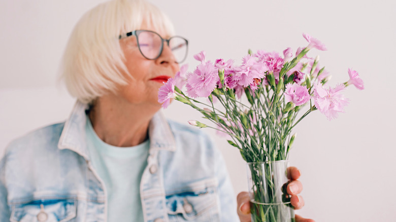 woman smelling flowers