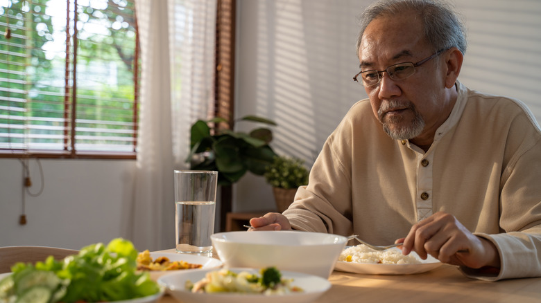 man preparing to eat