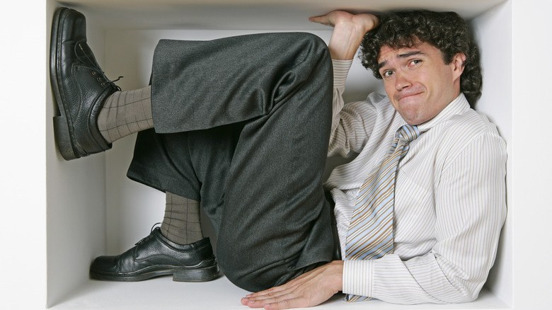 man trapped in a box