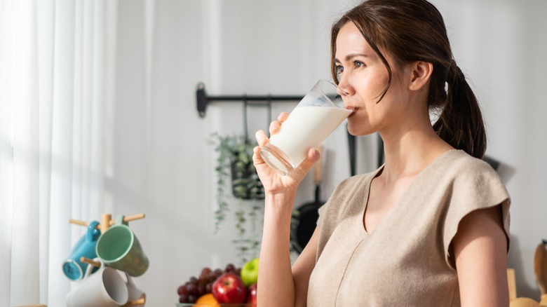 Woman drinking a glass of milk