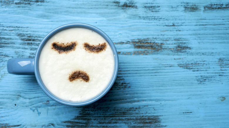 coffee cup with sad face