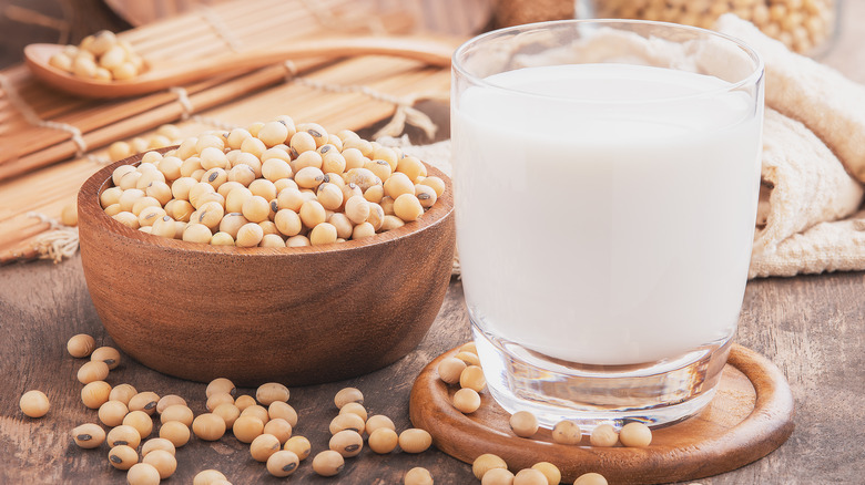 A bowl of soybeans next to milk