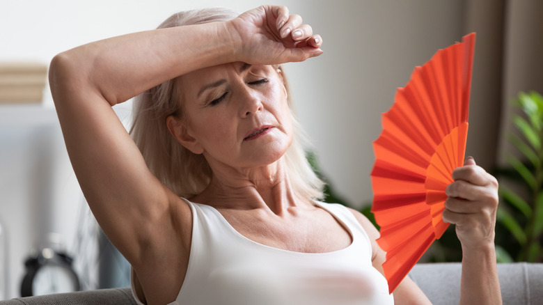 Woman holding fan